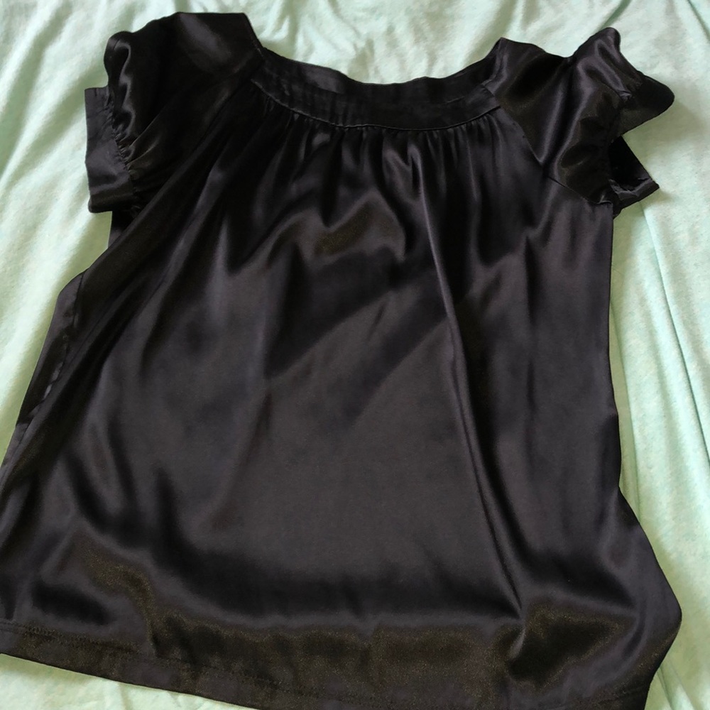 Black shiny, sexy, and comfortable shirt.
